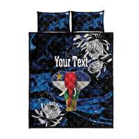 King quilt bed set with black and blue abstract print, elephant flag center, “Your Text”