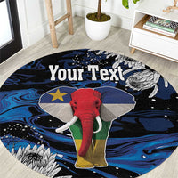 Round elephant graphic area rug with blue, black, red, white, and yellow accents