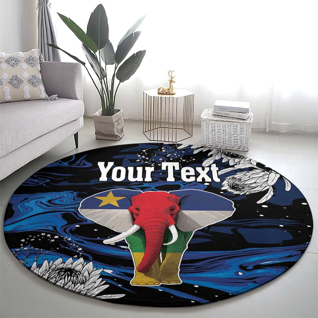 Round elephant printed rug with dark background, blue waves, gray wings, and white feathers