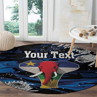 Round elephant area rug with custom text and map-like star motif in blue and black