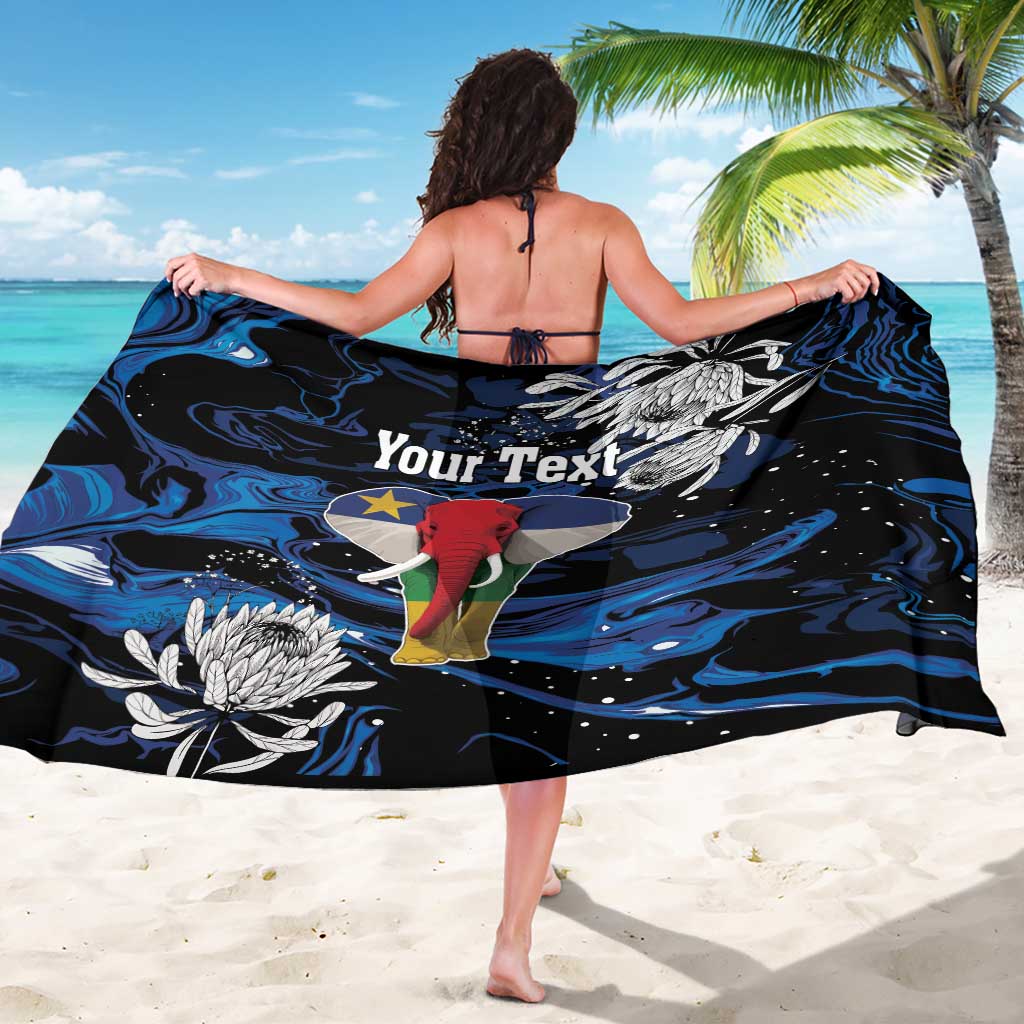 Black elephant-themed sarong draped on a woman’s back, with blue swirls and “Your Text”
