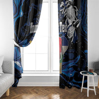 Blue and black elephant window curtain pair framing a white door window opening.