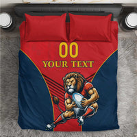 Red and navy duvet set with lion mascot holding a ball, 'YOUR TEXT' and '00', two pillowcases