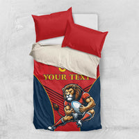 Red and navy bedding set with lion mascot holding ball, 'YOUR TEXT' and '00', two red pillowcases