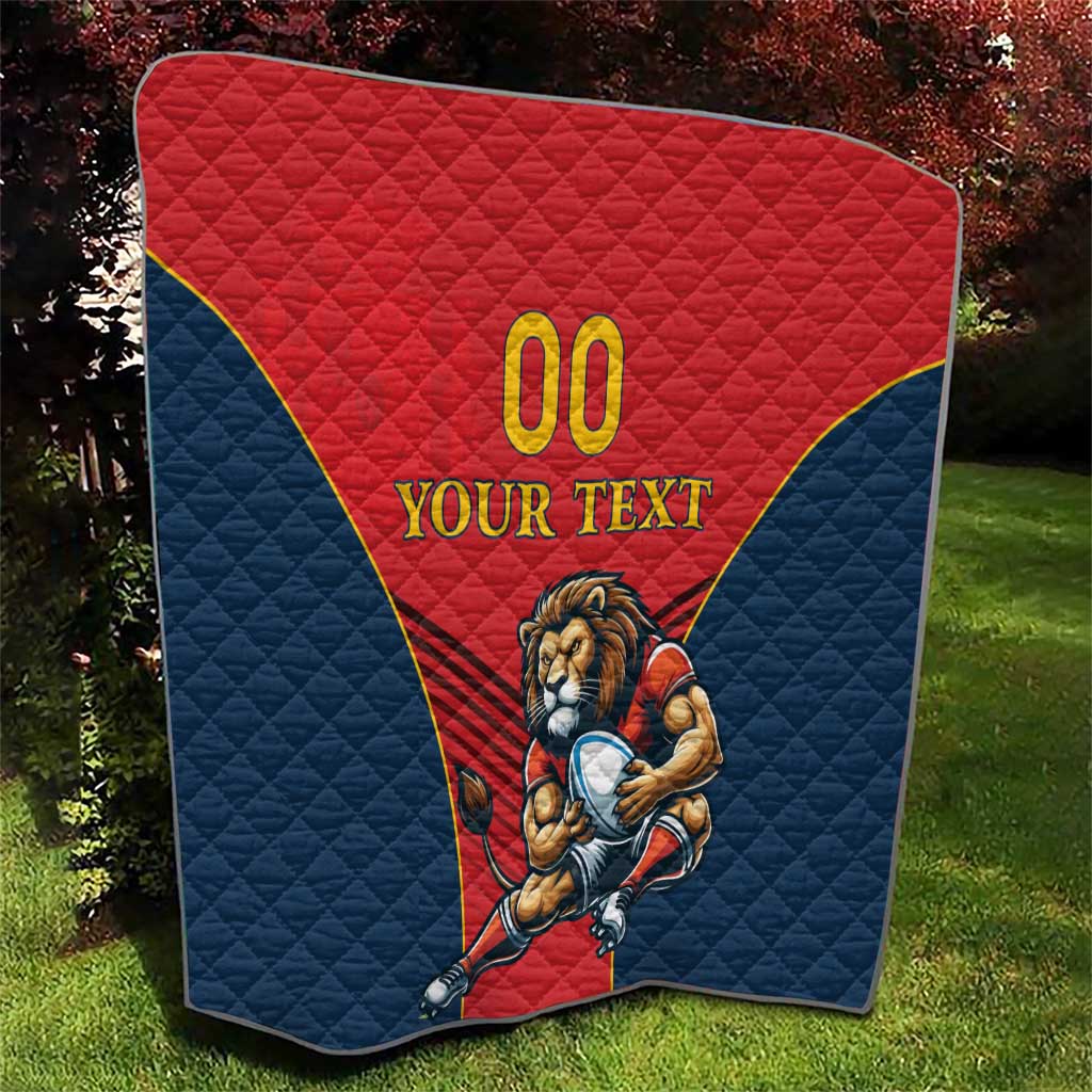 Rugby quilt blanket outdoors, red triangle with “00” and lion mascot