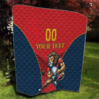 Rugby quilt blanket outdoors, red triangle with “00” and lion mascot