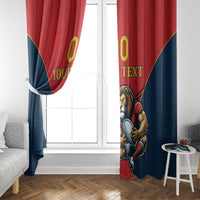 Red and navy lion mascot window curtain hanging beside a white door