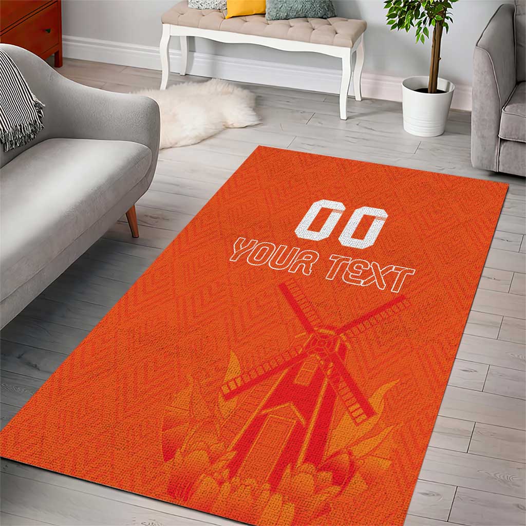 Orange custom area rug with windmill artwork and white 'YOUR TEXT' logo