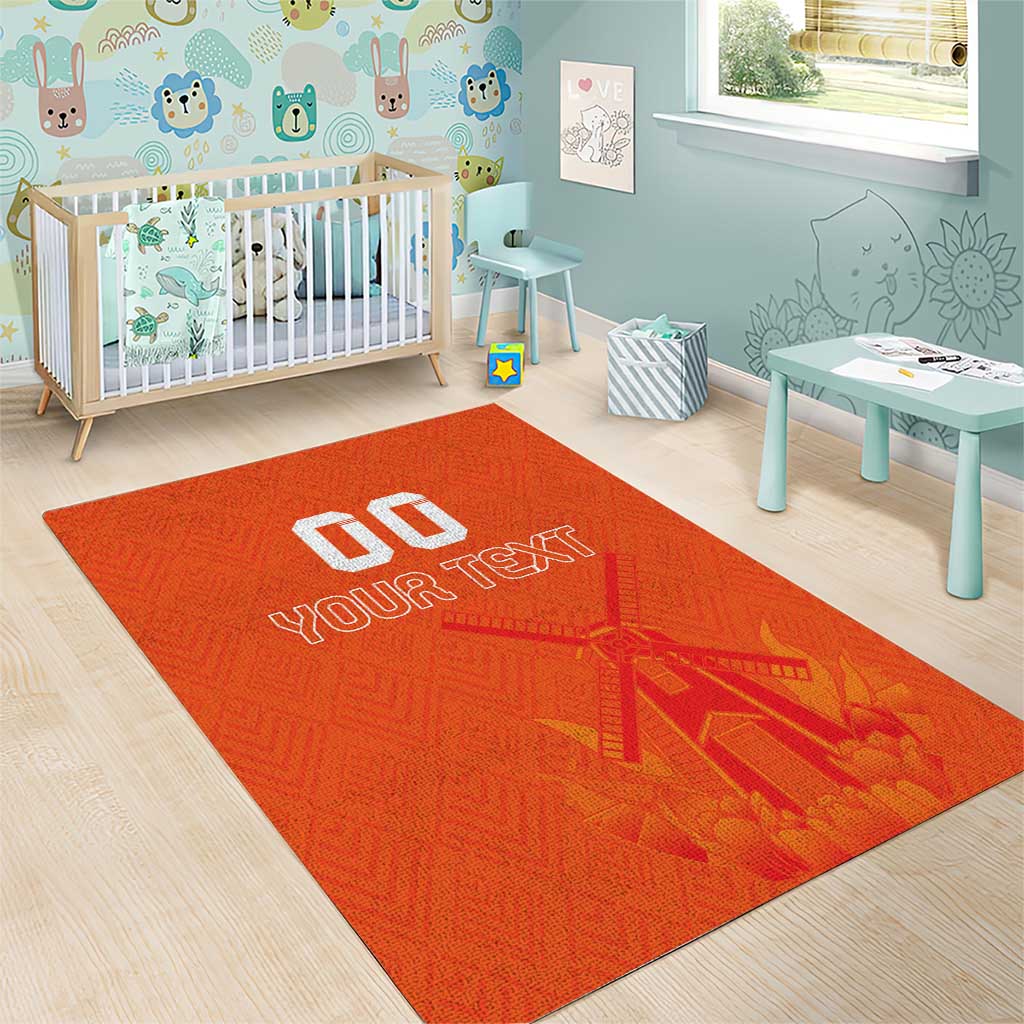 Orange area rug with windmill design and white 'YOUR TEXT' typography