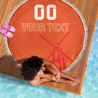 Orange round beach blanket with white fringe, custom text, round woven edge close-up