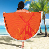 Orange round beach blanket with white fringe, custom text, windmill graphic