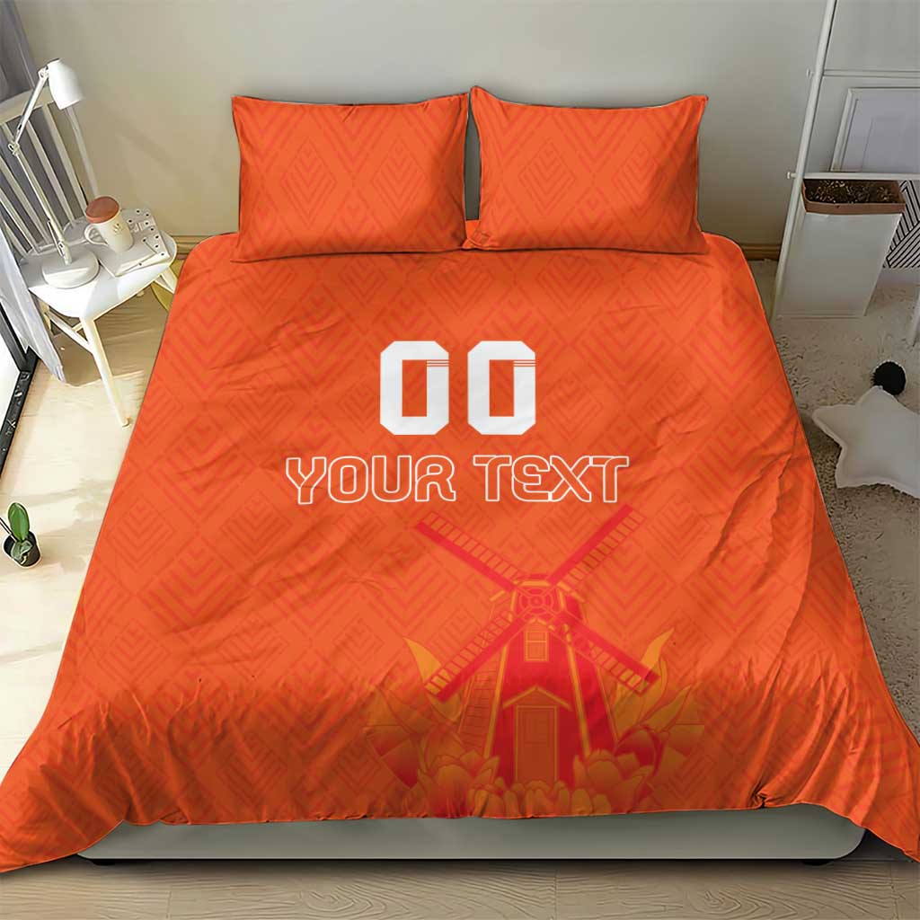 Orange duvet cover set with two pillows, windmill artwork centered above “YOUR TEXT”.