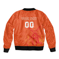 Orange bomber jacket back with black ribbed collar and large graphic print reading YOUR TEXT 00