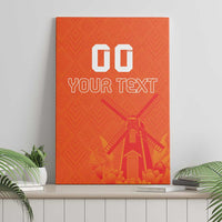 Orange canvas wall art with windmill and tulip graphic, custom text, on shelf
