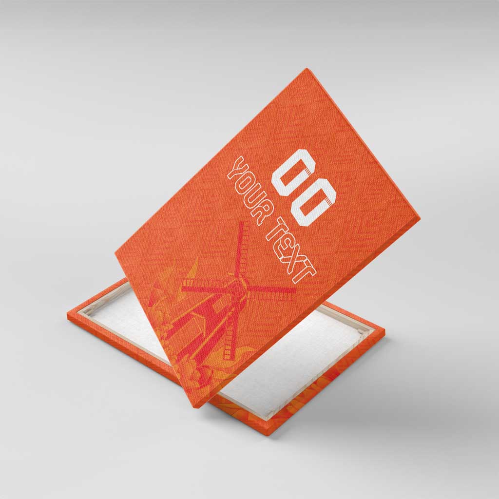 Orange canvas wall art angled on display stand, windmill and tulip motif, custom text