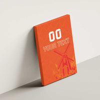 Orange canvas wall art on wall, windmill and tulip motif with custom text