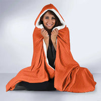 Orange hooded blanket with white sherpa hood and front graphic with 00