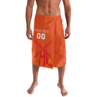 Orange patterned drawstring shorts with elastic waistband and jersey-style graphic