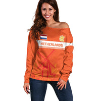 Orange off-shoulder sweater with Netherlands jersey graphic and tulip/windmill print