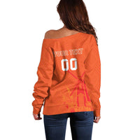 Orange off-shoulder sweater back view with YOUR TEXT 00 graphic and jersey pattern