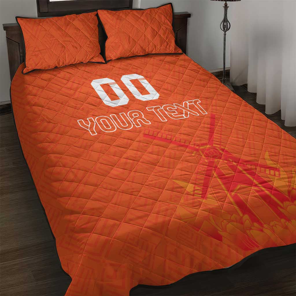 Orange quilt bed set with quilted pattern, two pillow covers, and 'YOUR TEXT'