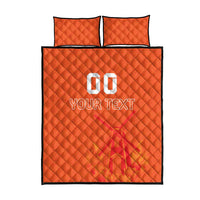 Orange quilt bed set with quilted pattern, two pillows, and '10 YOUR TEXT' design