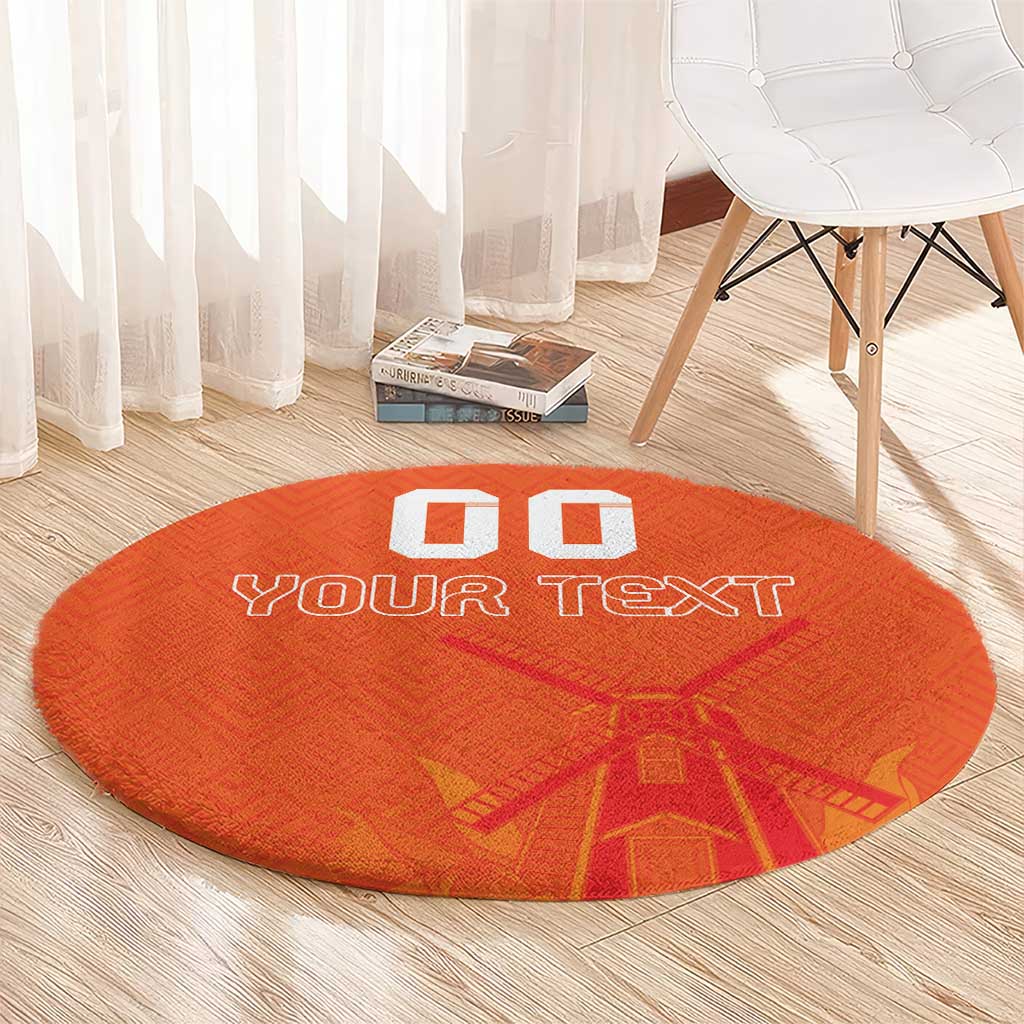 Orange round rug with “YOUR TEXT” and windmill-style pattern, custom blocks