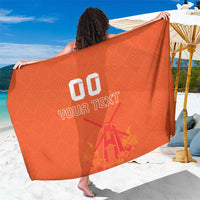 Orange sarong towel with windmill and tulip print and 'YOUR TEXT' center graphic