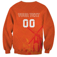 Orange sweatshirt back with custom text and number 00 over windmill and tulip design