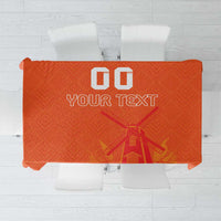 Orange tablecloth with windmill and tulips jersey pattern and space for custom text