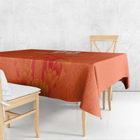 Orange tablecloth with windmill and tulips jersey pattern, corner drape on wooden benches