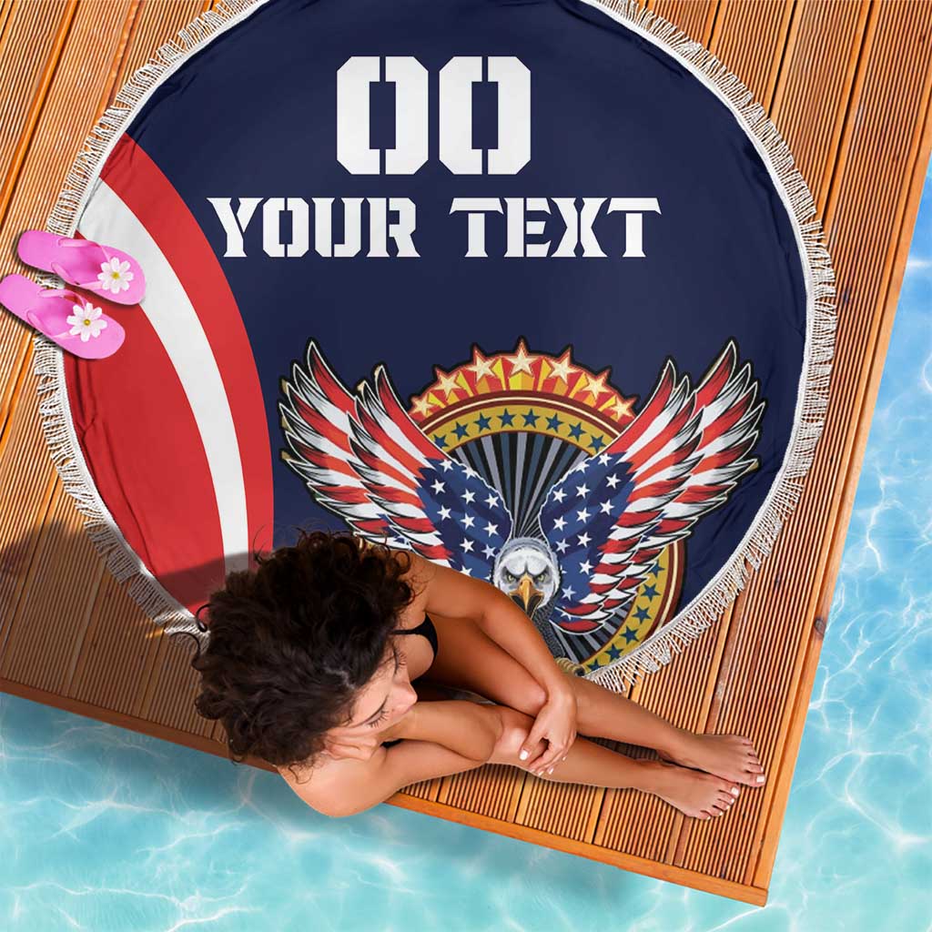 Navy round beach blanket with eagle crest and red white stripe, fringed edge