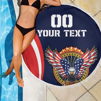 Navy round beach blanket with eagle badge, red white stripe, and fringed edge