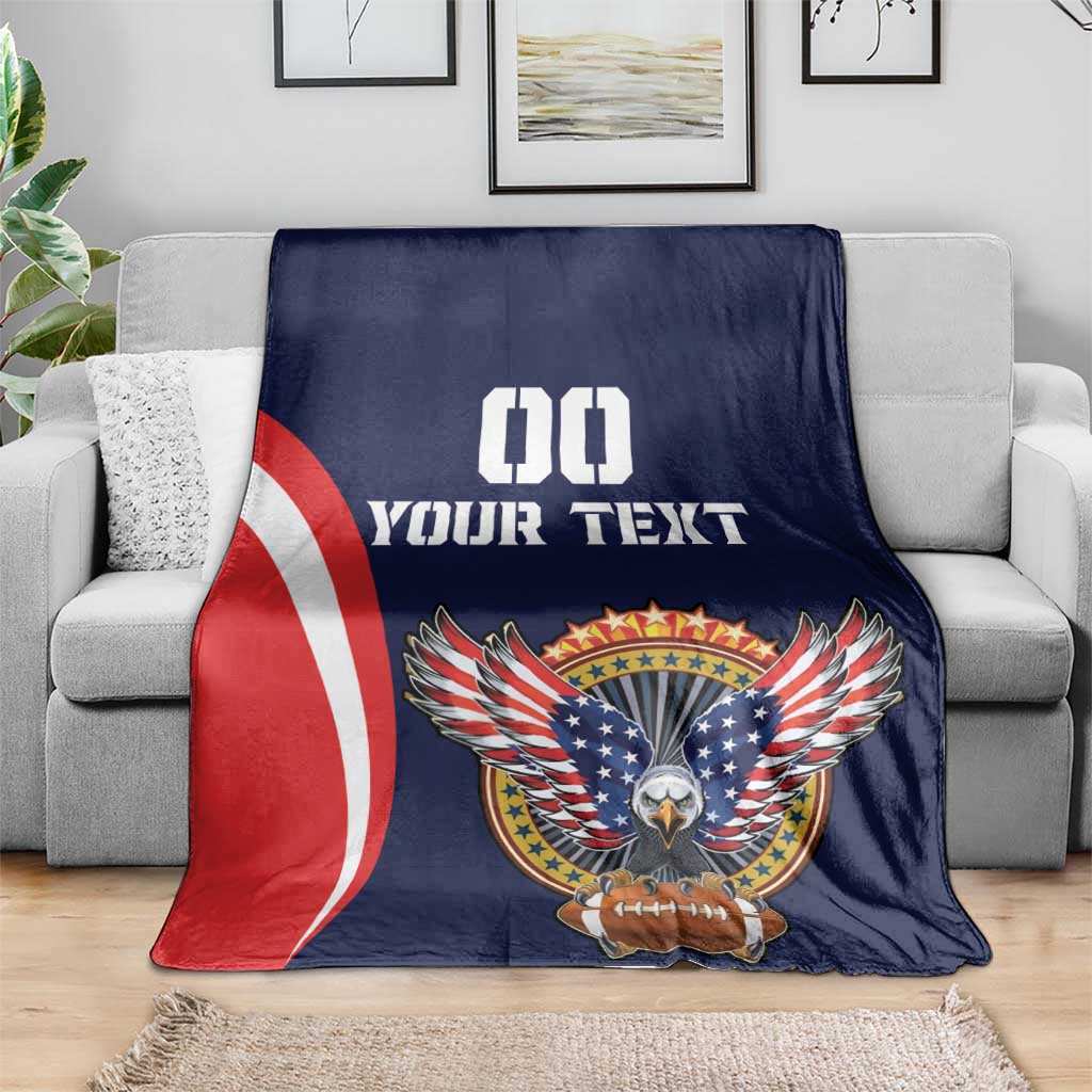 Navy USA rugby blanket on gray sofa with eagle, football emblem, red-white stripes, '00 YOUR TEXT'