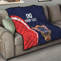Blue quilt on sofa with red-and-white arc stripe, eagle-and-football graphic, custom text.