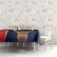 Navy rugby-style tablecloth with rugby ball graphic and USA eagle, floral setting backdrop