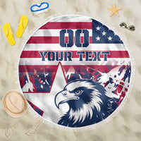 Round beach blanket showing navy eagle head, USA flag stripes, and white fringe border