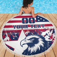 Round beach blanket with navy eagle head, red-white-blue striped design, and white fringe