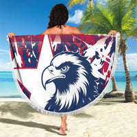 Round beach blanket with eagle graphic in navy, red-white-blue shapes, and white fringe