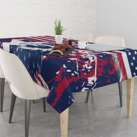 Red, white and blue tablecloth with eagle design covering dining table
