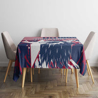 Red, white and blue tablecloth with bold pattern across round table scene