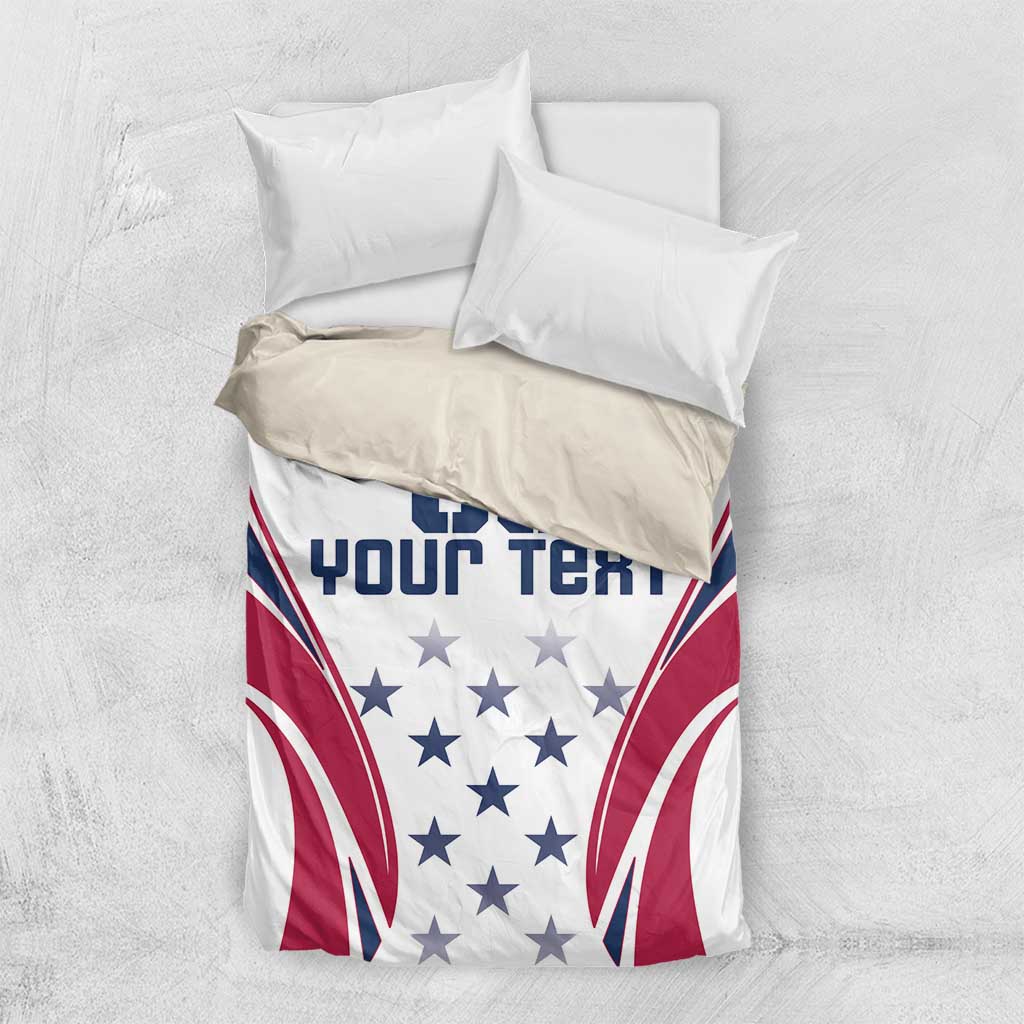 Folded white duvet cover with pillow shams showing navy/red rugby flag graphic and stars