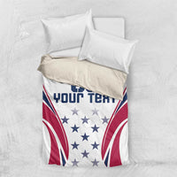 Folded white duvet cover with pillow shams showing navy/red rugby flag graphic and stars