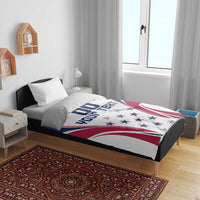 White duvet cover on bed with two pillow shams, navy/red rugby flag design and star motif