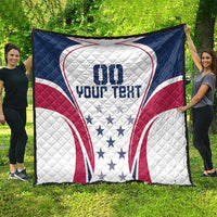 Large quilt held outdoors, white star pattern with blue and red rugby-style heart graphic