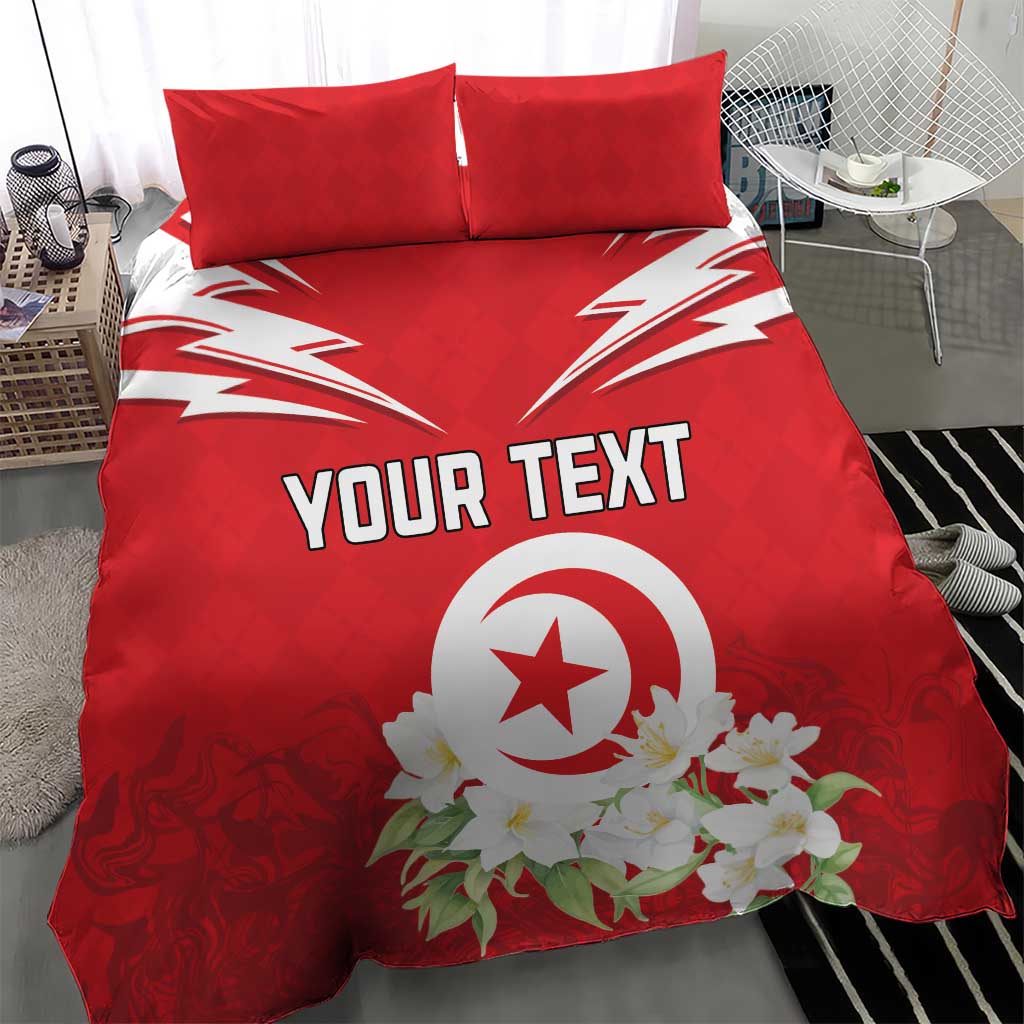 Red bedding set showing “YOUR TEXT” and a central emblem with white floral accents