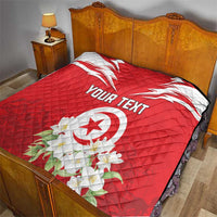 Red bed quilt with Tunisia emblem, jasmine flowers, and “YOUR TEXT” print