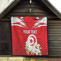 Red quilt with quilted texture, Tunisia emblem, jasmine flowers, and “YOUR TEXT”