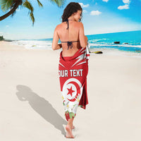 Red sarong worn around the legs with Tunisia emblem and jasmine flowers