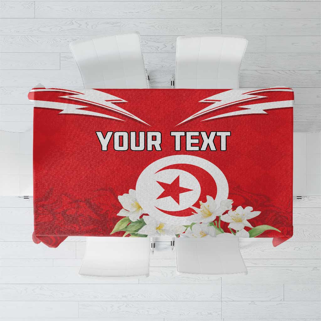 Red personalized tablecloth with Tunisian emblem, “YOUR TEXT”, and white jasmine flowers